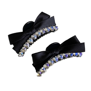 Elegant set of two black ribbon bow hair clips with heart-shaped rhinestones for women