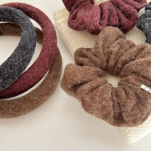 Detailed view of plush autumn winter hair bands and headbands in assorted warm colors