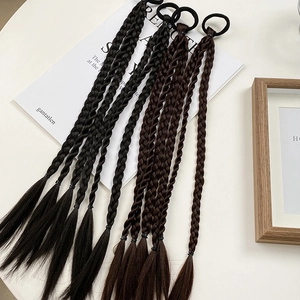 Close-up of 45cm black and dark brown braided ponytail hair ties in a flat lay setup