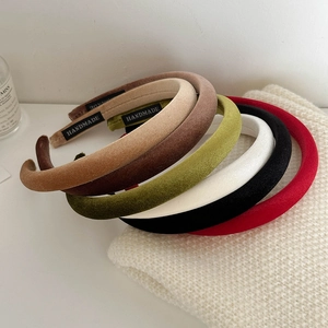 Classic solid velvet thin headbands set with handmade label on white knit background