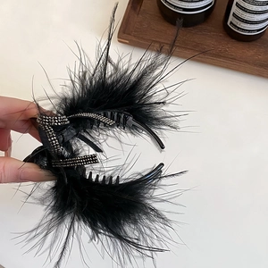 Elegant black feather hair claw clip with rhinestone bow for high ponytail styling