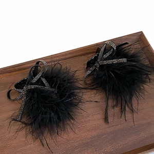 Elegant black feather hair claw clips with rhinestone bows for stylish high ponytails