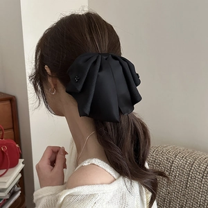 Elegant black satin bow hair claw clip with beaded cross patterns for women's low ponytail
