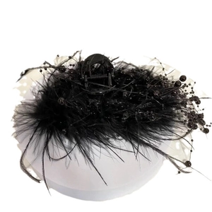 Elegant black feather hair claw clip with bead tassels for a vintage look
