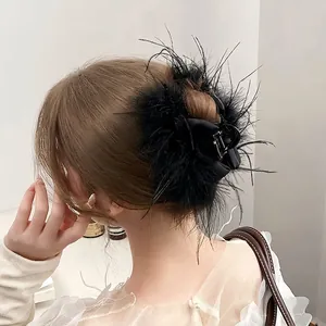 Winter ostrich feather hair claw clip with black bow and elegant princess style design