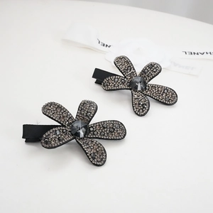 Pair of luxury black flower hair clips with sparkling rhinestones and grey crystals