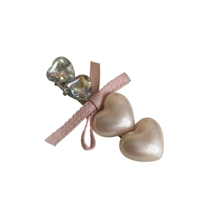 Vintage style hair clip featuring pink ribbon bow and crystal heart shapes for women