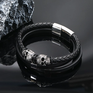 Men's multilayer braided leather bracelet featuring vintage skull charms and magnetic clasp