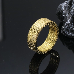 Men's punk stainless steel ring with textured scale pattern on black stone background