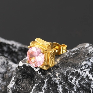 Macro shot of single pink zircon earring with vintage floral engravings on gold setting