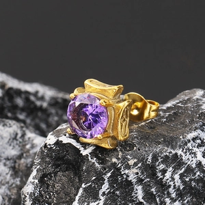 Vintage gold stud earring with purple round stone on dark rock, dark style jewelry
