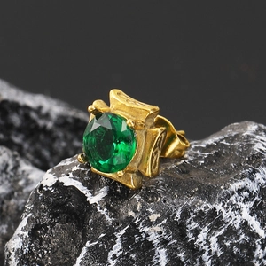 Macro shot of vintage square green zircon stud earring set in engraved gold titanium steel