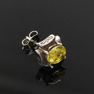 Macro shot of square zircon stud earring with vintage floral engravings and back butterfly