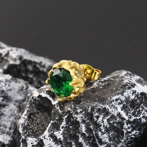 Macro detail of emerald green zircon stud earring with retro 18K gold flower setting