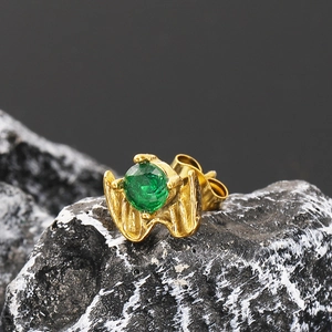 Punk vintage wing claw stud earrings in gold with a central green zircon stone