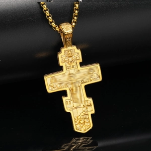 Vintage gold Orthodox cross pendant with ornate engravings on a beaded chain