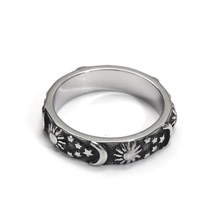 Retro stainless steel ring with sun, moon, and star engravings on a polished band