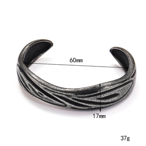 Vintage irregular titanium steel cuff bracelet with 60mm diameter and wavy texture