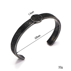 Detailed view of vintage Viking steel cuff with Celtic knots and 14mm round ornament