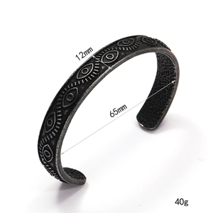 Bracelet manchette rétro en acier inoxydable avec yeux gravés et finition vintage oxydée