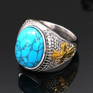 Macro detail of vintage men's ring with blue turquoise stone and gold accent