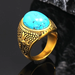 Macro shot of vintage titanium steel ring featuring an oval blue turquoise gemstone inlay