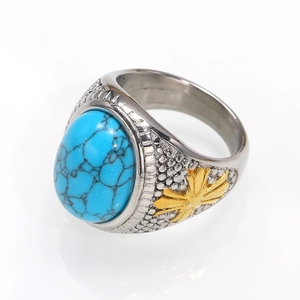 Vintage titanium steel ring featuring an oval blue turquoise stone and gold floral details