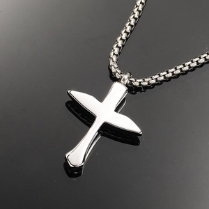Polished stainless steel feather cross urn necklace with pendant on black mirror base