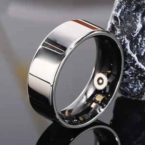 Macro shot of smart ring interior showing heart rate sensor and micro circuit board