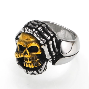 Punk style titanium steel skull ring featuring gold skull and silver hand bone accents