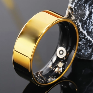 Macro view of smart ring showing internal sensor circuit and gold polished metal exterior