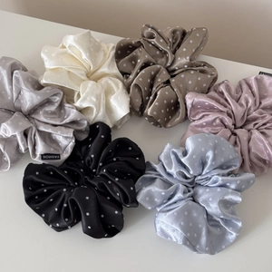 Set of six colorful satin polka dot hair scrunchies with elegant fashion tags