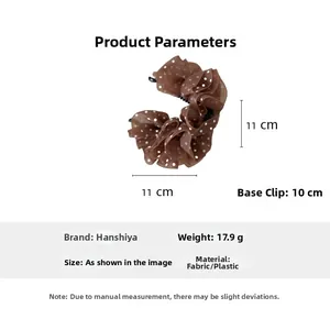 Detailed view of brown polka dot banana hair clip with specific size and weight labels