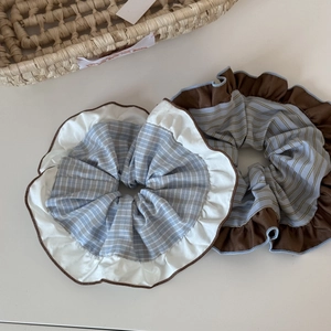 Oversized ruffled scrunchie set with blue and brown contrast patterns for hair styling