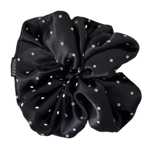 Satin black polka dot scrunchie hair tie with fashion label and glossy texture