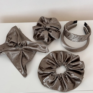 Taupe satin hair accessories set with black polka dots featuring bows and scrunchies