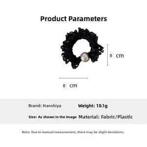 Detail view of 8cm black lace scrunchie with large pearl bead decoration and 10.1g weight