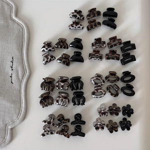 Leopard print and black resin hair claw clips set in floral and geometric shapes
