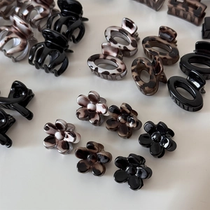 Detailed set of leopard print and solid hair claws including floral and oval designs