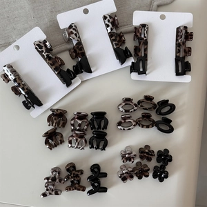 Detail of leopard print and floral hair claw clip set in various shapes and patterns