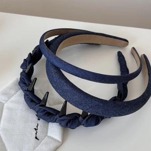 Detailed macro shot of vintage blue denim headbands with various textures and non-slip lining