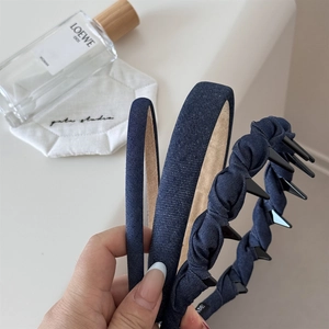 Detailed close-up of dark blue denim textured headbands with anti-slip inner lining