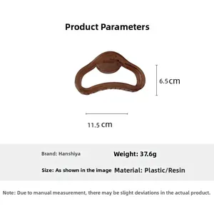 Pince à cheveux marron translucide avec mesures de 11,5 cm de large et 6,5 cm de haut