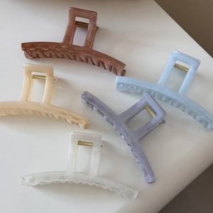 Set of five large acetate hair claw clips with elegant marble textures in diverse colors