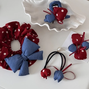 Vintage red polka dot hair accessory set featuring bows, scrunchies and shark clips
