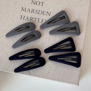 Set of 8 fabric-covered geometric hair clips in grey and navy blue for styling hair