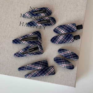 Set of 8 plaid fabric hair clips in red, blue, and white tartan patterns