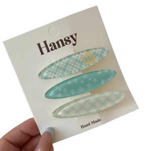 Juego de tres bonitas pinzas para el cabello de acrílico con cuadros y estrellas