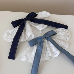 Elegant white lace bow hair clip featuring denim fabric accents in dark and light blue shades