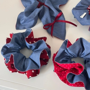 Detailed macro view of handmade denim blue and red polka dot fabric scrunchie set